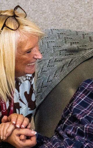 St Marks Manager talking and laughing with elderly resident